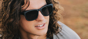 Male wearing Swank XL blackout sunglasses