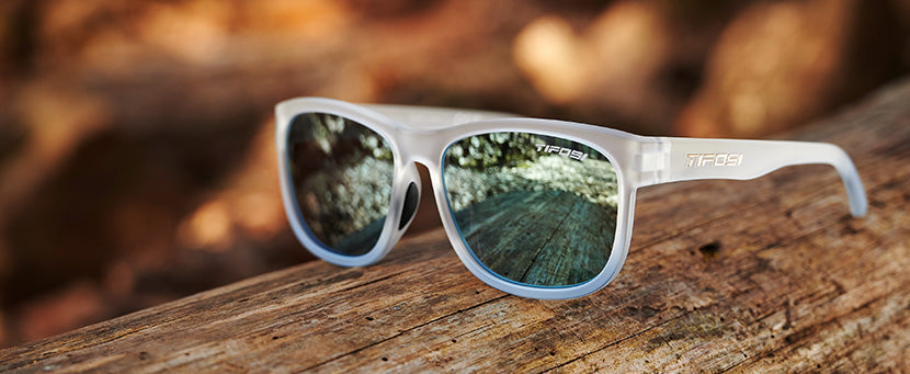 Swank XL frost blue sunglasses in the woods