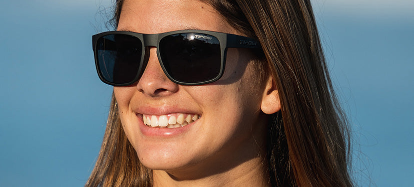 Female wearing Swick blackout sunglasses