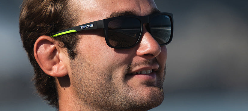 male wearing Swick satin black neon sunglasses