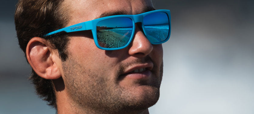 Male wearing Swick shadow blue sunglasses