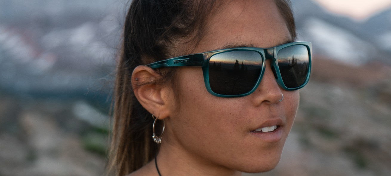 Female wearing Swick marble blue sunglasses