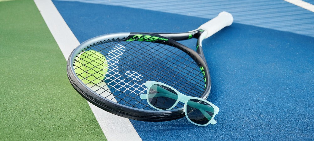 Swank sunglasses on tennis court