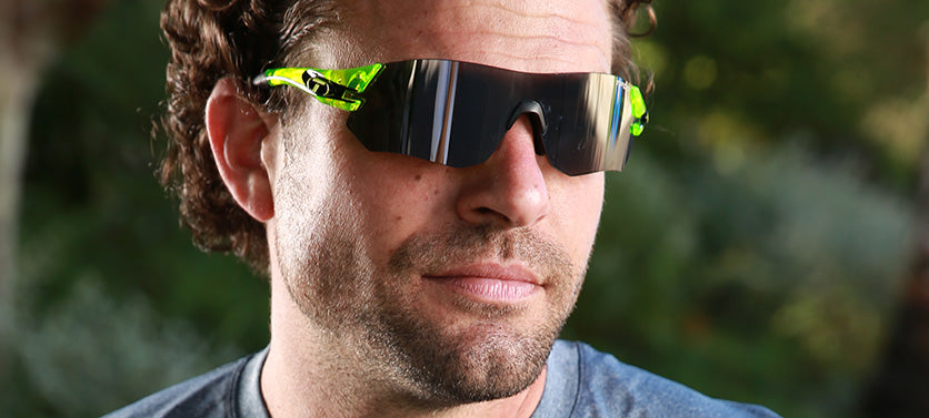 Male wearing Tsali Neon Green sunglasses with Smoke tint lens