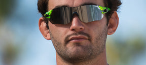 Male wearing Tsali Neon Green sunglasses with Smoke tint lens