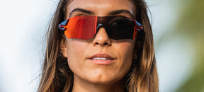Female wearing Tsali Gunmetal Red with Clarion Red lens sunglasses