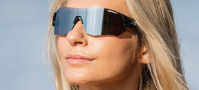 Female wearing Tsali Matte Black sunglasses with Smoke tinted lens