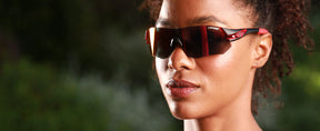 Female wearing Tsali Gunmetal Red sunglass with Clarion Red lens